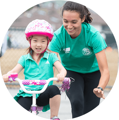 A smiling boy catching a ball