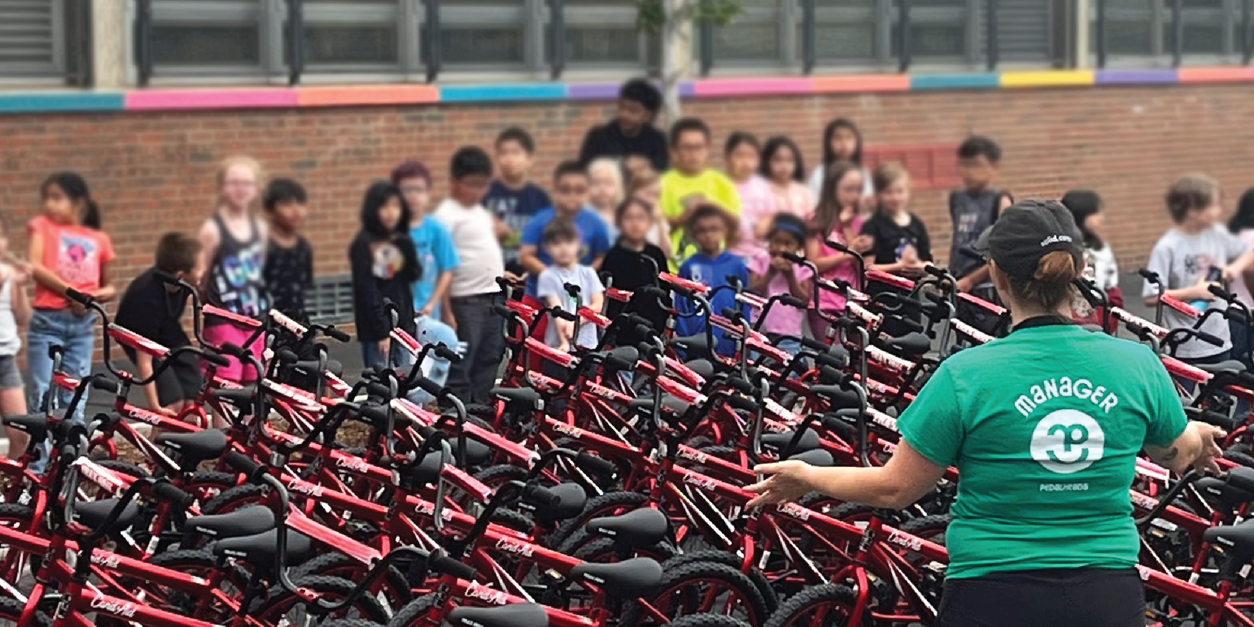 Pedalheads+-manager-giving-brand-new-bikes-to-Pedalheads+-campers