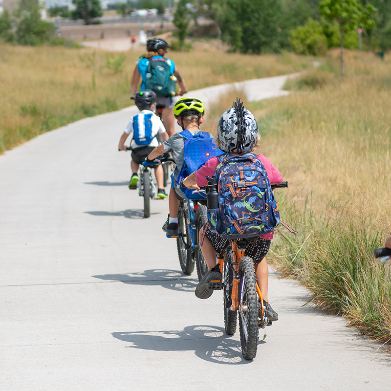 Kids riding a trail following their instructor